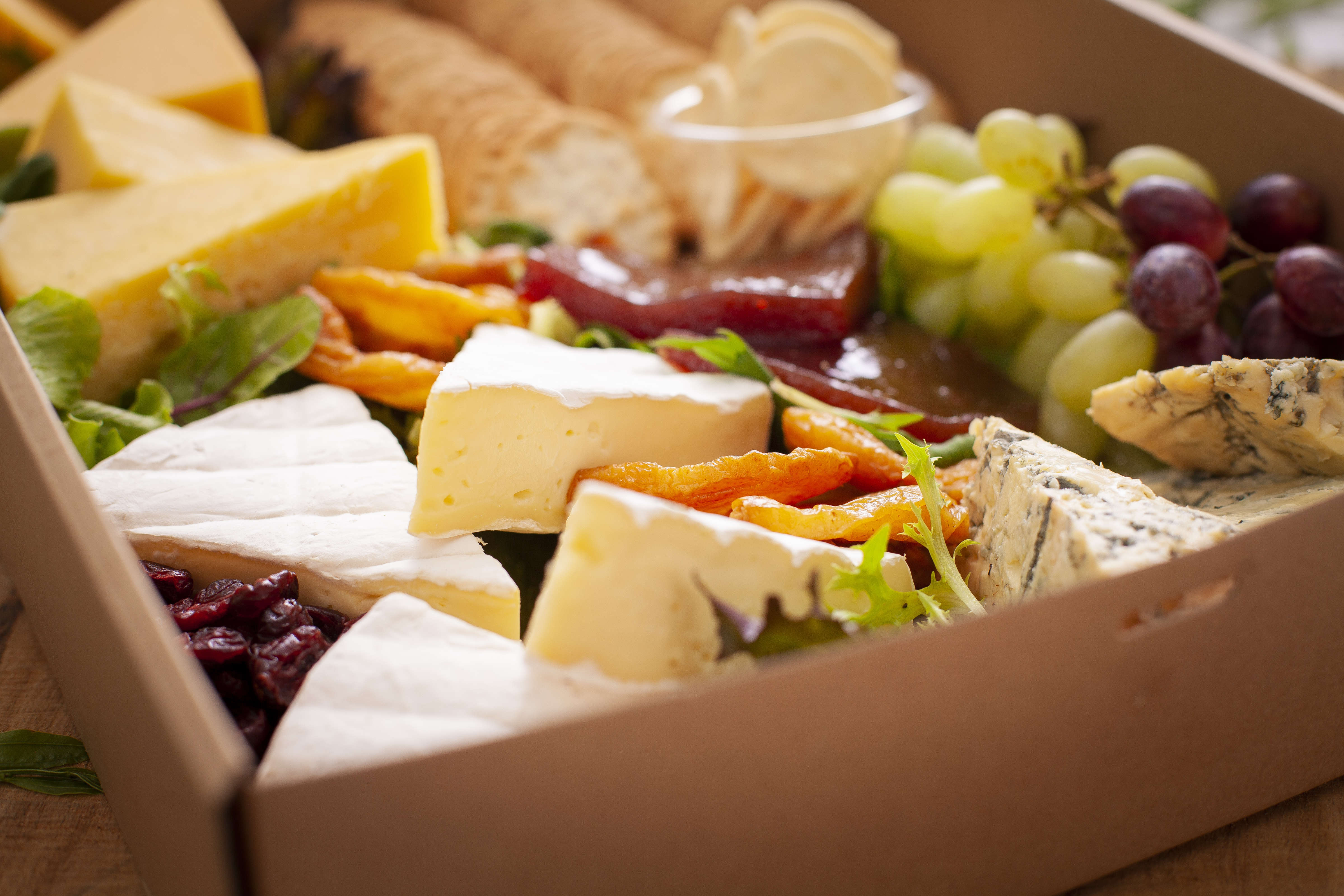 Tasmanian cheese box including Brie, Blue and Cheddar with quince paste and crackers. Photo: Richard Jupe.