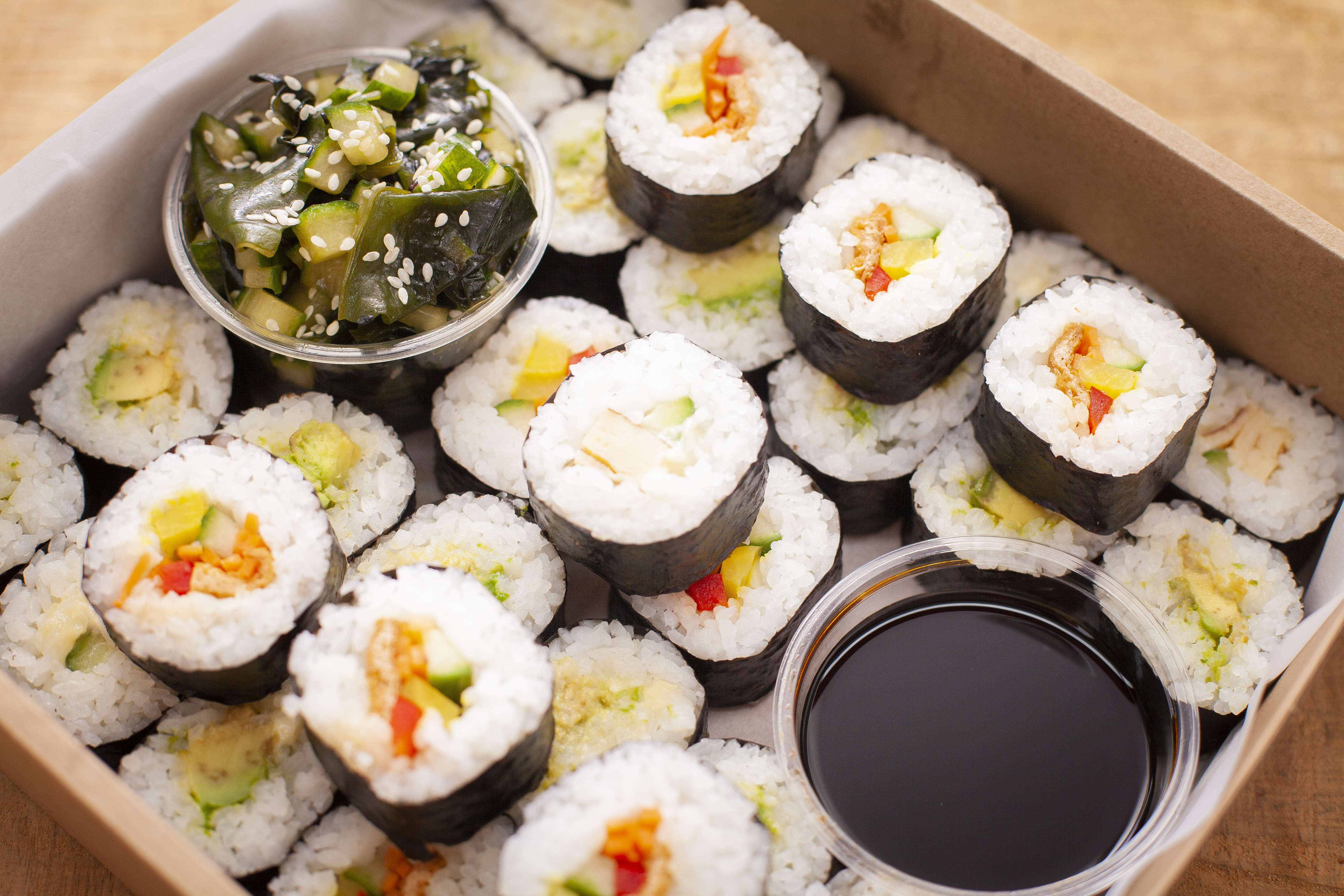 Sushi box containing 32 pieces of vegan and vegetarian sushi with soy sauce. Photo: Richard Jupe.