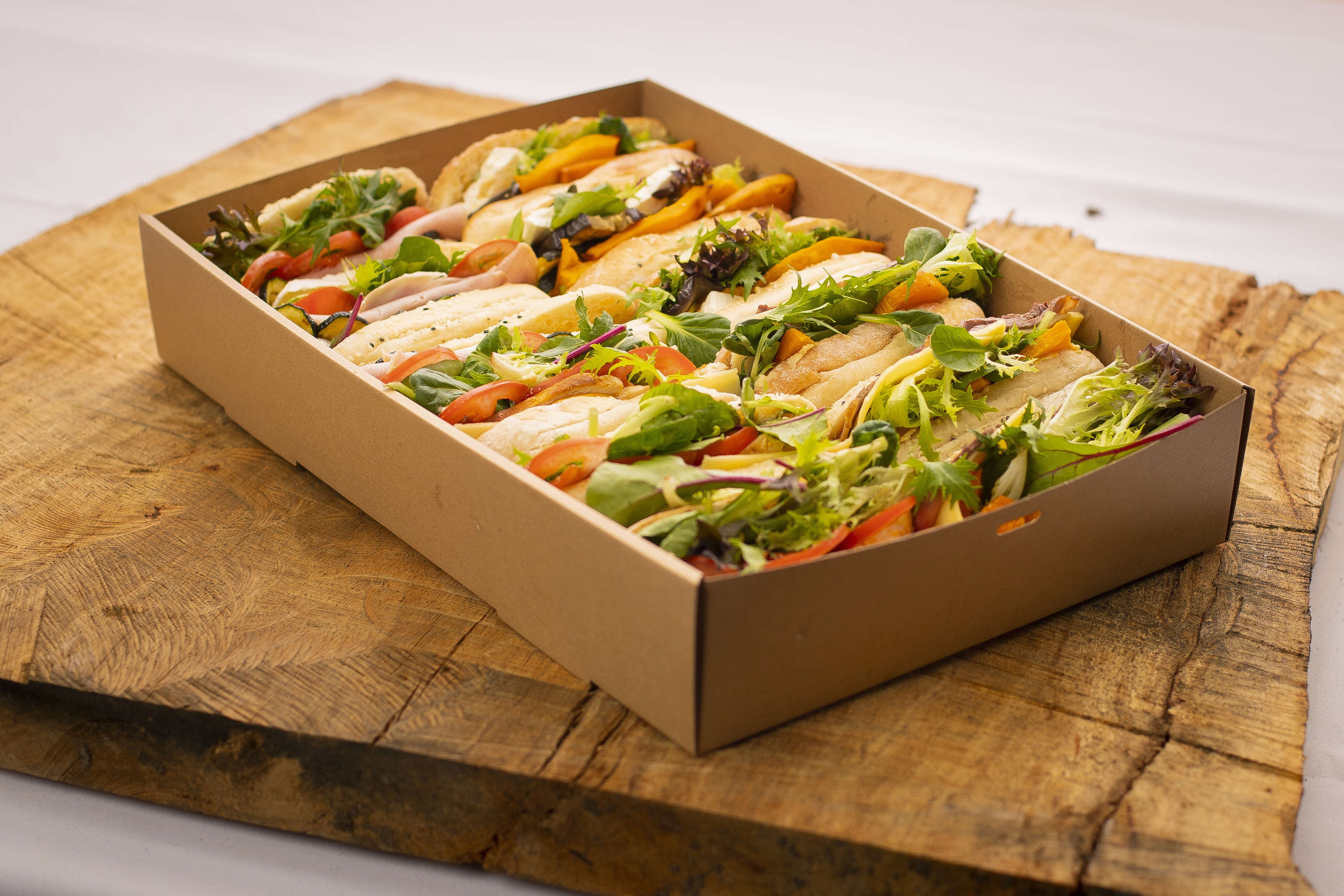 Turkish pide catering box containing twelve rolls; fillings include free range ham with salad, roasted vegetables with feta. Photo: Richard Jupe.